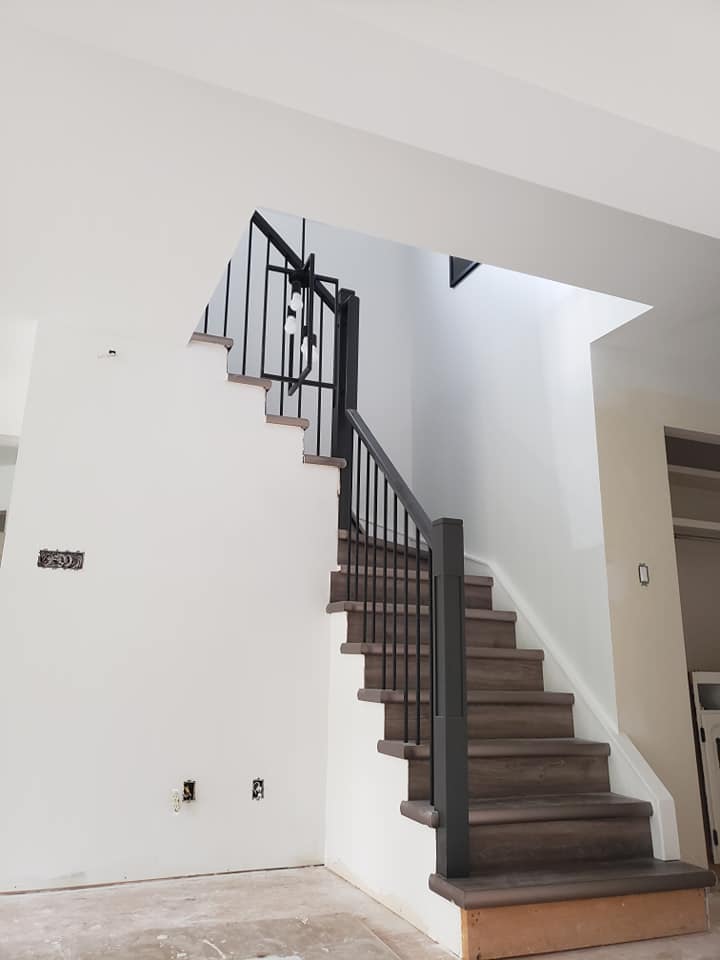 Beautiful stairway with finished walls, painted and complete.